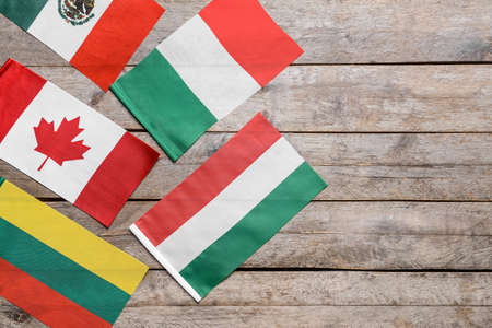 Different flags on wooden backgroundの写真素材