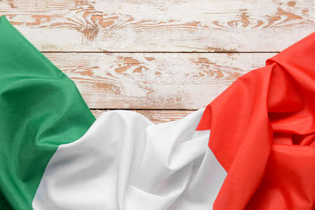 Italian flag on light wooden background, closeupの写真素材