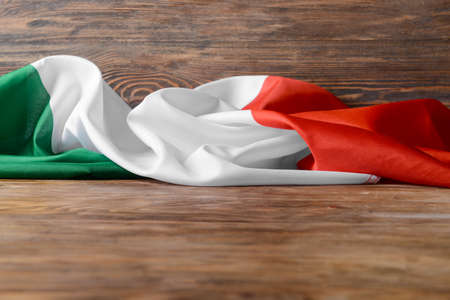 Italian flag on wooden background, closeupの写真素材