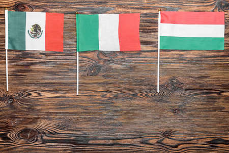 Different flags on wooden backgroundの写真素材