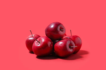 Fresh red apples on color backgroundの写真素材
