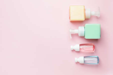 Bottles with cosmetics products on color backgroundの写真素材