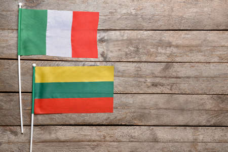 Flags of Italy and Bolivia on wooden backgroundの写真素材