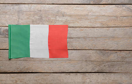 Italian flag on wooden backgroundの写真素材