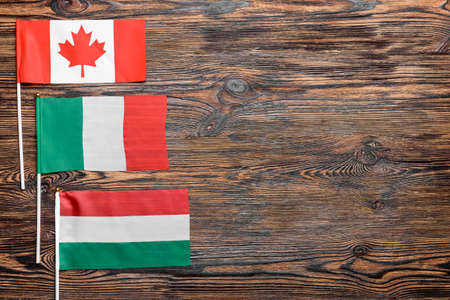 Different flags on wooden backgroundの写真素材