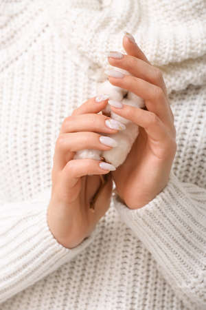 Young woman with beautiful manicure and cotton flowers, closeupの写真素材