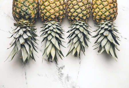 Fresh pineapples on white backgroundの写真素材