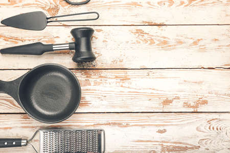 Set of kitchen utensils on light wooden backgroundの写真素材