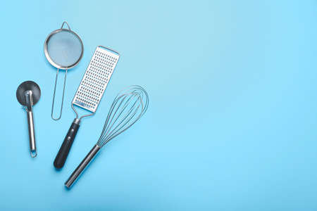 Set of kitchen utensils on color backgroundの写真素材