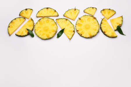 Slices of fresh pineapple on white backgroundの写真素材
