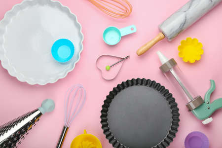 Set of kitchen utensils on color background