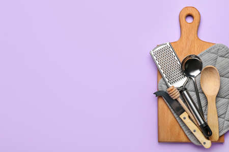 Set of kitchen utensils on color backgroundの写真素材