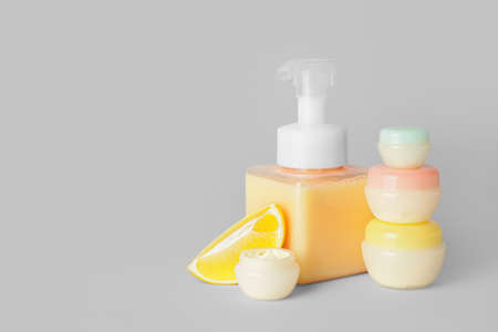 Natural cosmetic products with citrus fruit on gray backgroundの写真素材