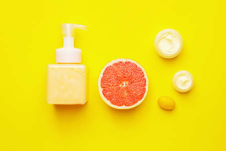 Natural cosmetic products with citrus fruits on color backgroundの写真素材