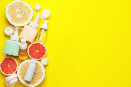 Natural cosmetic products with citrus fruits on color backgroundの写真素材