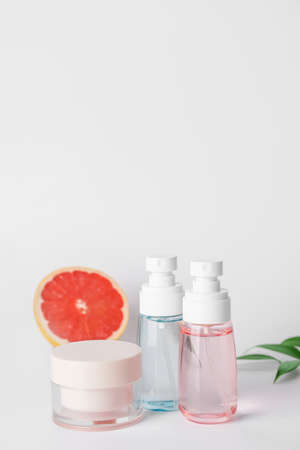 Natural cosmetic products with citrus fruit on gray backgroundの写真素材