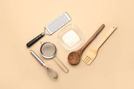Set of kitchen utensils on color background