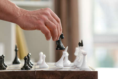 Man playing chess at home