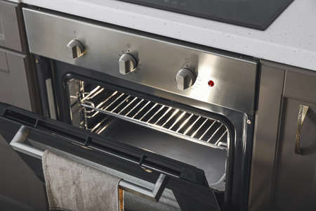 Open oven in modern kitchenの写真素材