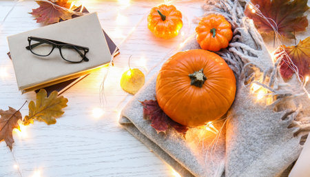 Pumpkins and glowing lights on windowsillの写真素材