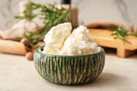 Bowl with shea butter on tableの写真素材