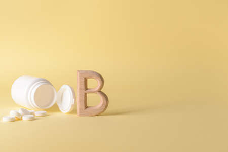 Vitamin B pills on color backgroundの写真素材