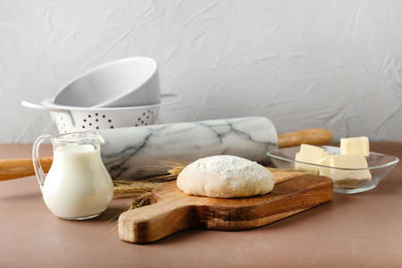 Ingredients for preparing bakery and utensils on color background