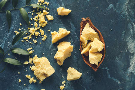 Composition with cocoa butter on color backgroundの写真素材