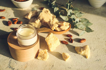 Composition with jar of cream and cocoa products on light backgroundの写真素材