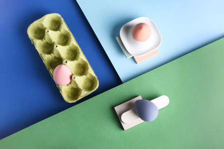 Creative composition with eggs holder and makeup sponges on color backgroundの写真素材