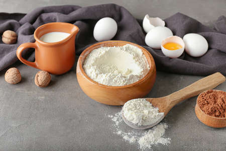 Ingredients for preparing bakery on gray background