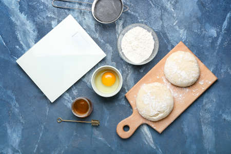Ingredients for preparing bakery and utensils on color backgroundの写真素材