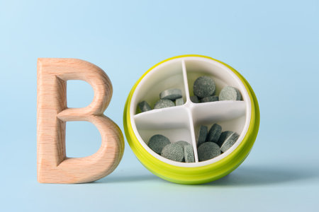 Vitamin B pills on color backgroundの写真素材