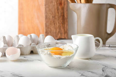 Ingredients for preparing bakery and utensils on light backgroundの写真素材