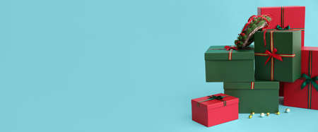 Beautiful Christmas gifts on blue background with space for textの写真素材