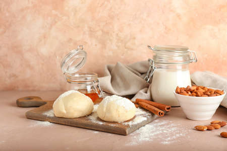 Ingredients for preparing bakery and utensils on color backgroundの写真素材