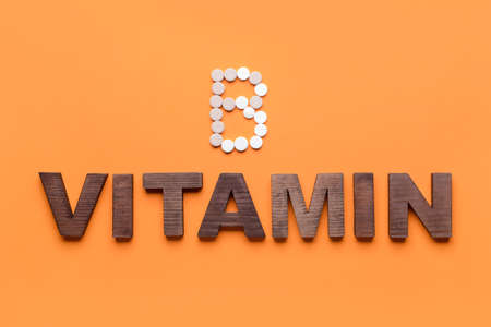 Word VITAMIN and letter B made of pills on color backgroundの写真素材