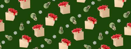 Beautiful gift boxes with Christmas balls on green backgroundの写真素材