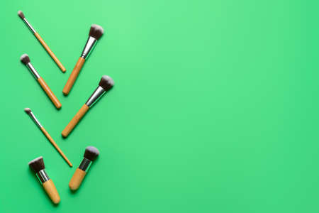 Set of professional makeup brushes on color backgroundの写真素材