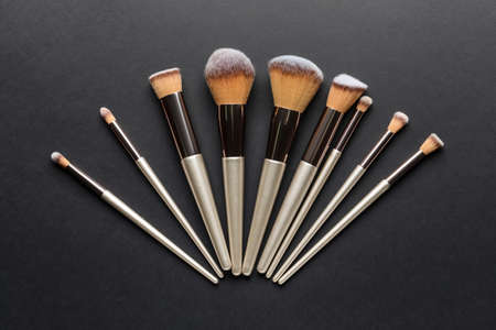 Set of professional makeup brushes on dark backgroundの写真素材