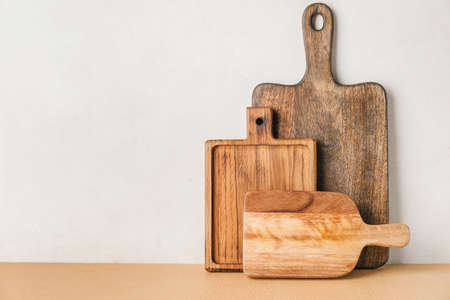 Wooden chopping boards on light backgroundの写真素材