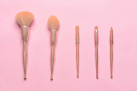 Set of professional makeup brushes on color backgroundの写真素材