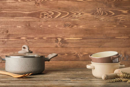 Cooking pots on wooden backgroundの写真素材