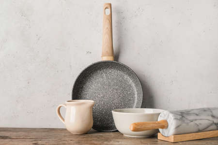 Set of kitchen utensils on light wooden backgroundの写真素材