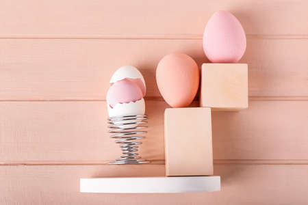 Creative composition with makeup sponges and egg holder on color wooden backgroundの写真素材