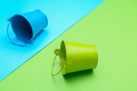 Different buckets on color backgroundの写真素材