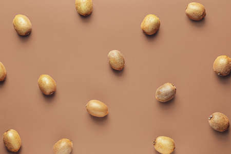 Many ripe kiwi on color backgroundの写真素材