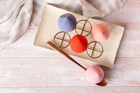 Creative composition with makeup sponges on light wooden backgroundの写真素材