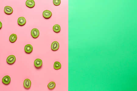 Cut ripe kiwi on color backgroundの写真素材