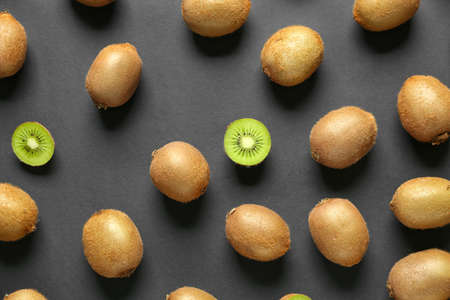 Many ripe kiwi on dark backgroundの写真素材